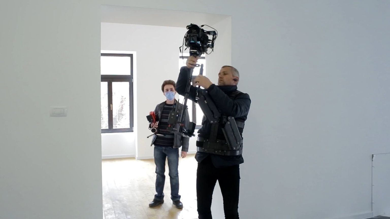 Film crew operating a camera gimbal on location